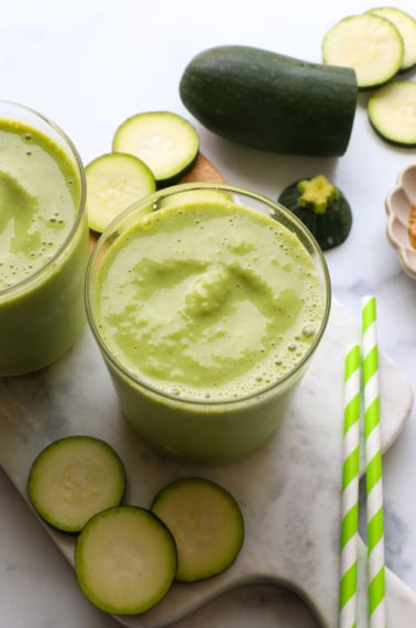 frosty zucchini smoothie in two glasses.
