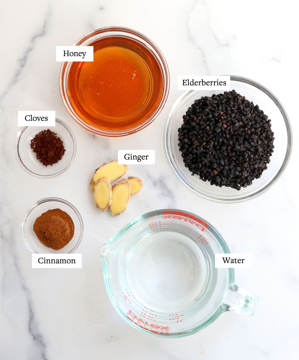 elderberry syrup ingredients in glass bowls