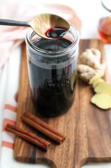 elderberry syrup on a spoon