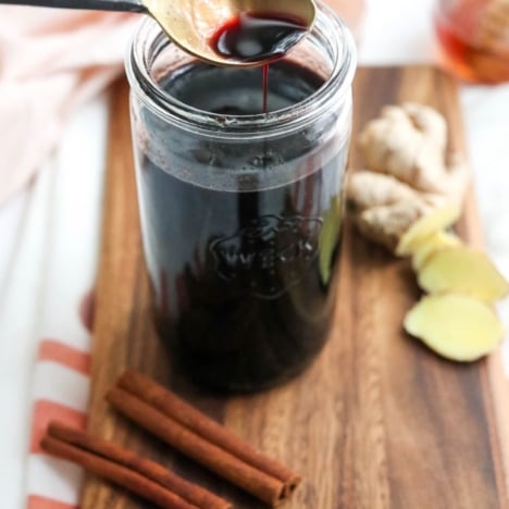 elderberry syrup on a spoon