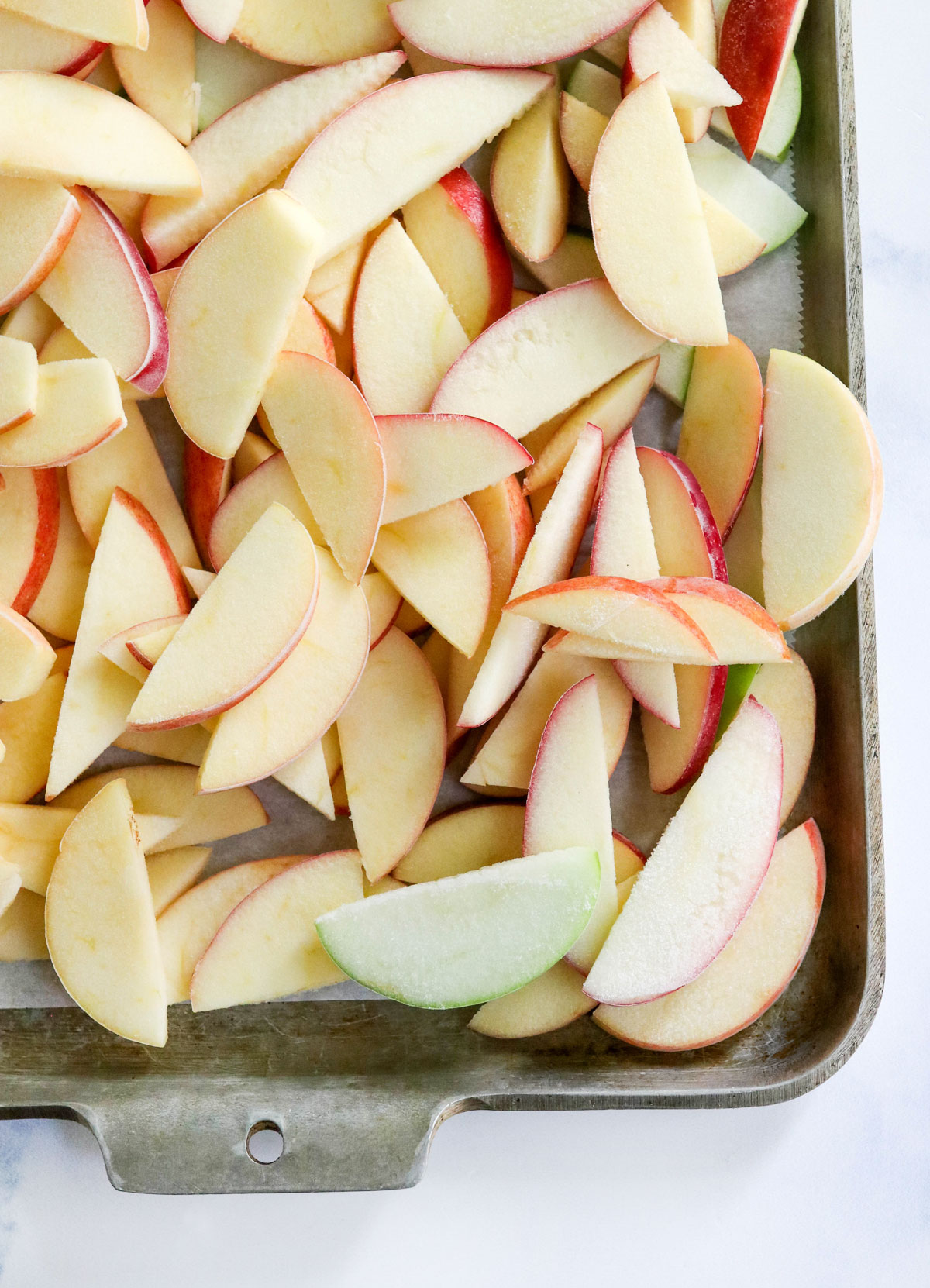 frozen apples on baking sheet