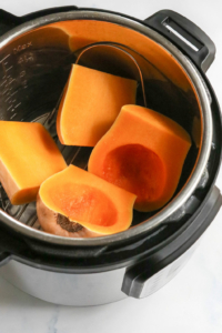 butternut squash cut into 4 pieces in pressure cooker
