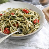 bowl of noodles tossed with kale pesto