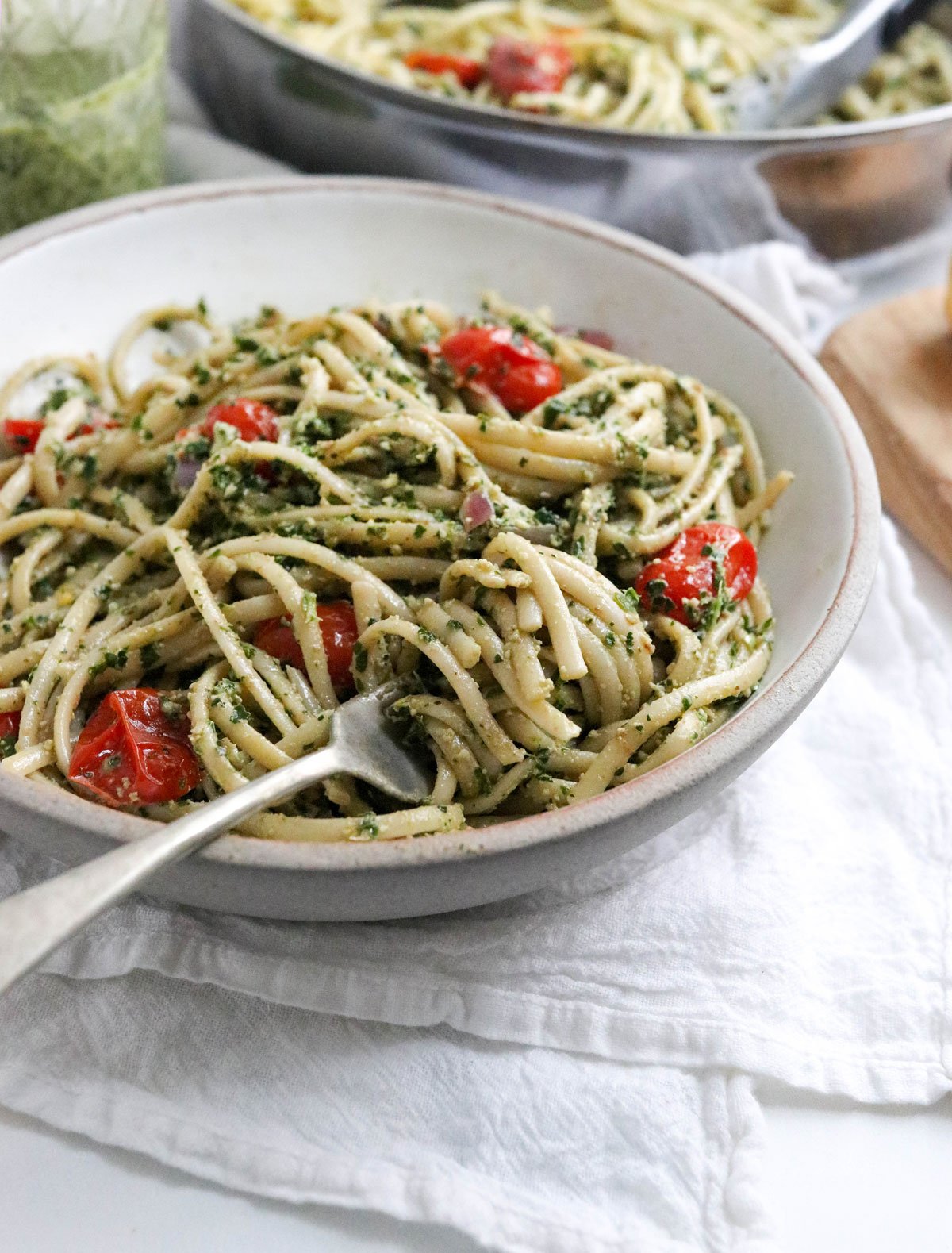 bowl of noodles tossed with kale pesto