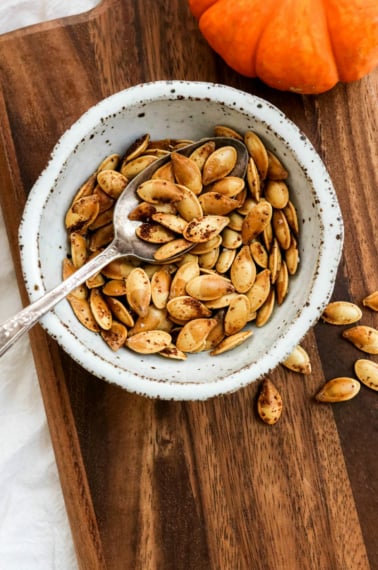 roasted pumpkin seeds in a white bowl