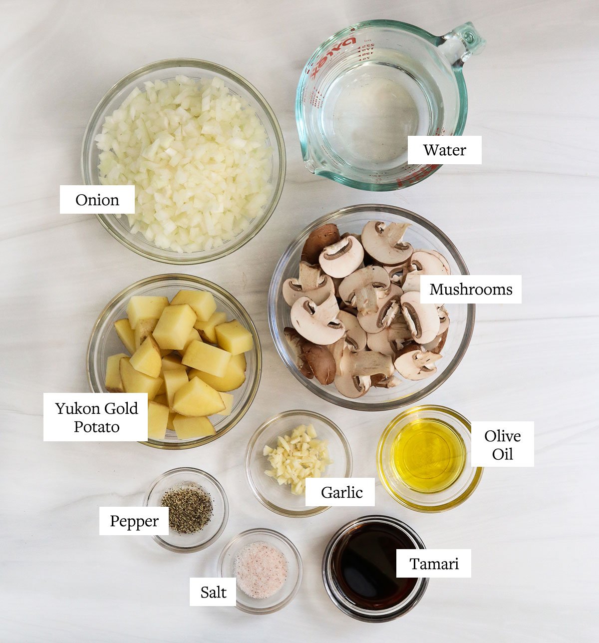 mushroom gravy ingredients labeled in glass bowls.