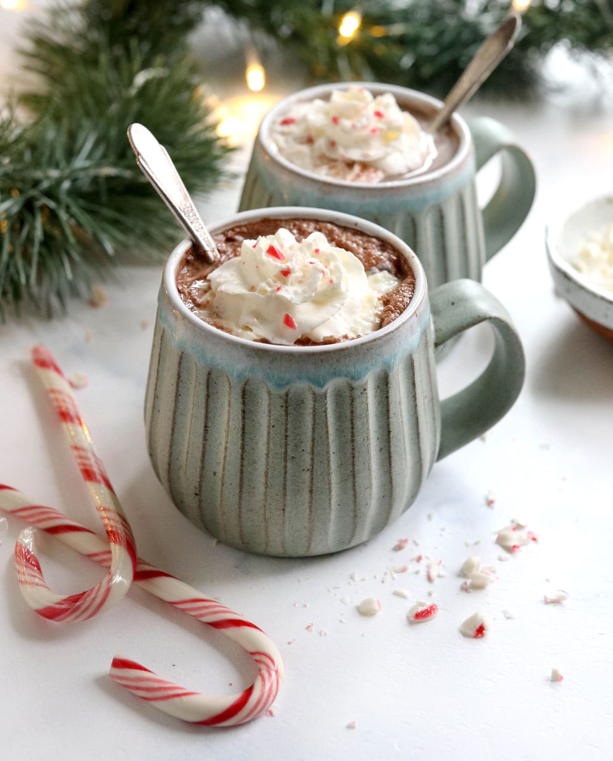 peppermint hot chocolate in mugs with candy canes