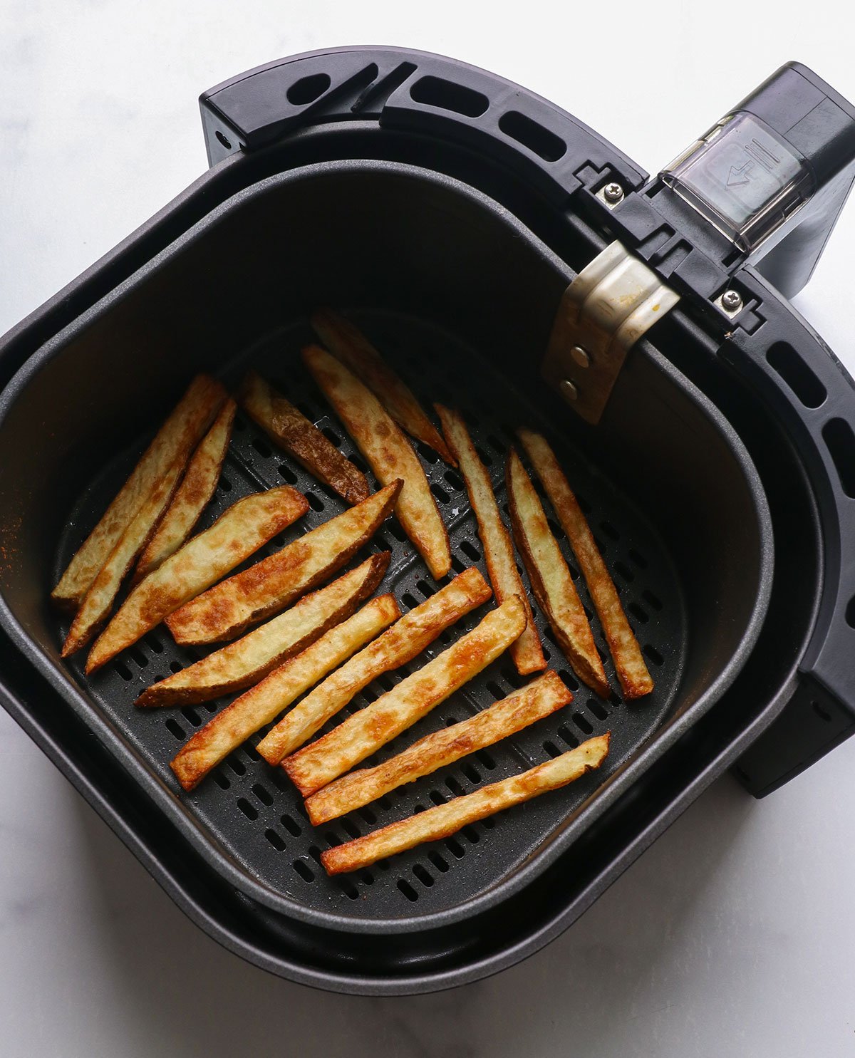 Cooked air fries in a basket.