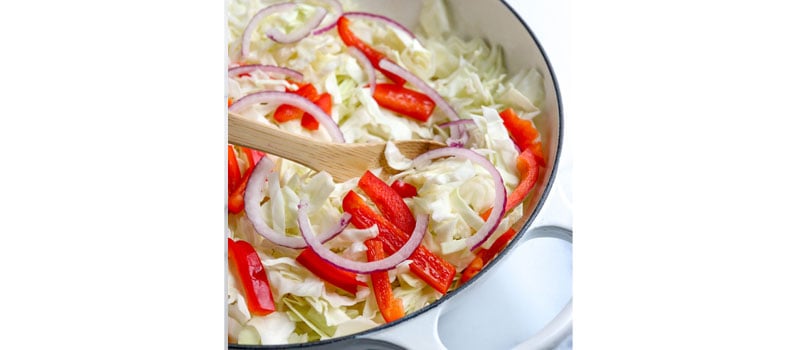 cabbage peppers and onions in pan