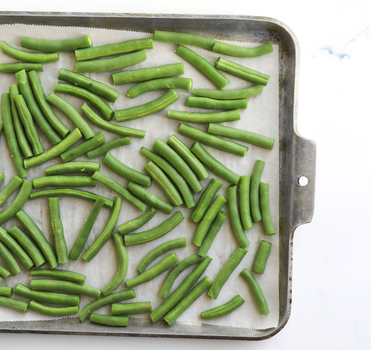 fresh green beans on a pan