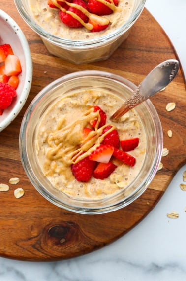 strawberries served on top of peanut butter overnight oats.