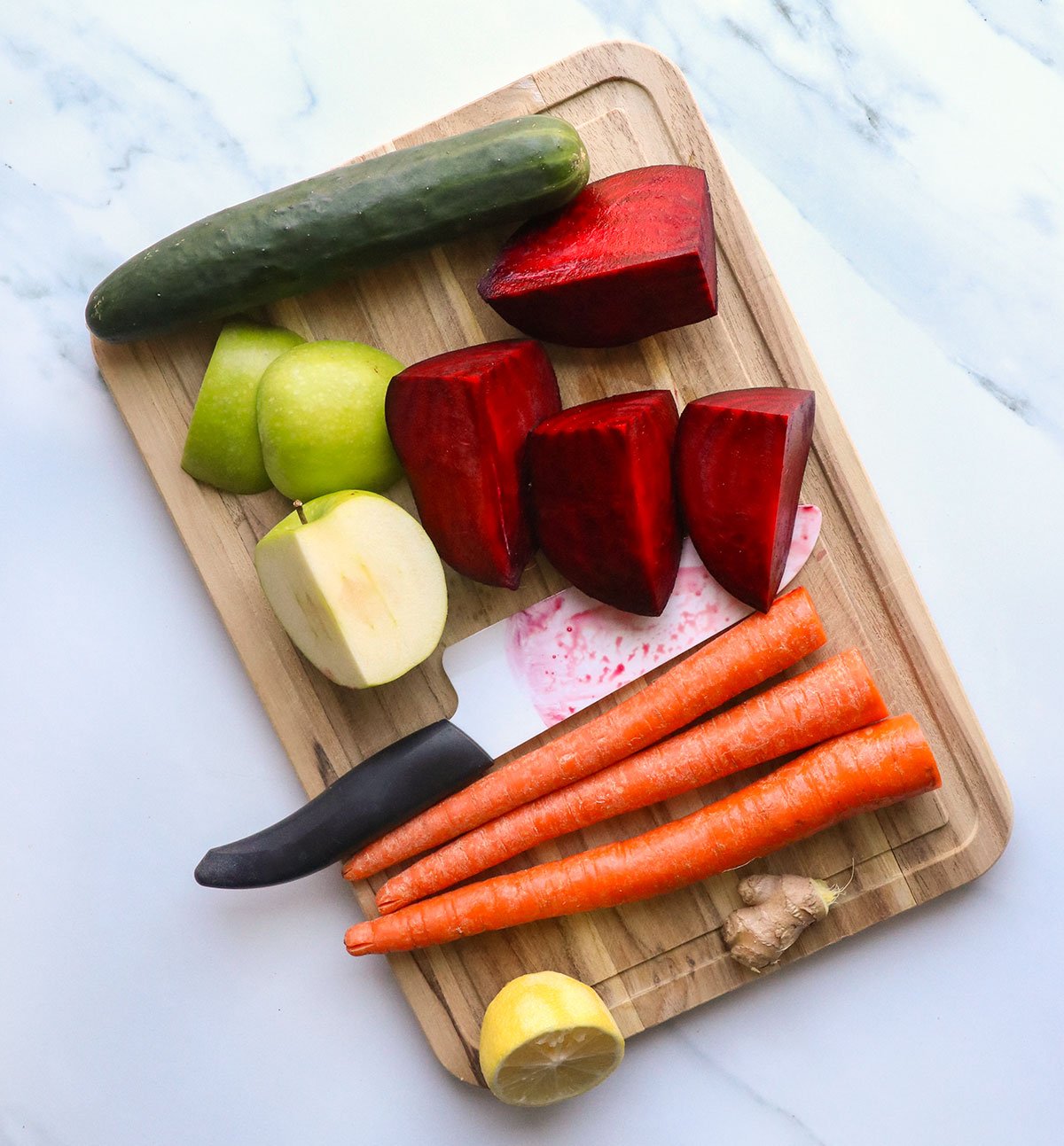 beet and apple sliced on a cutting board. 