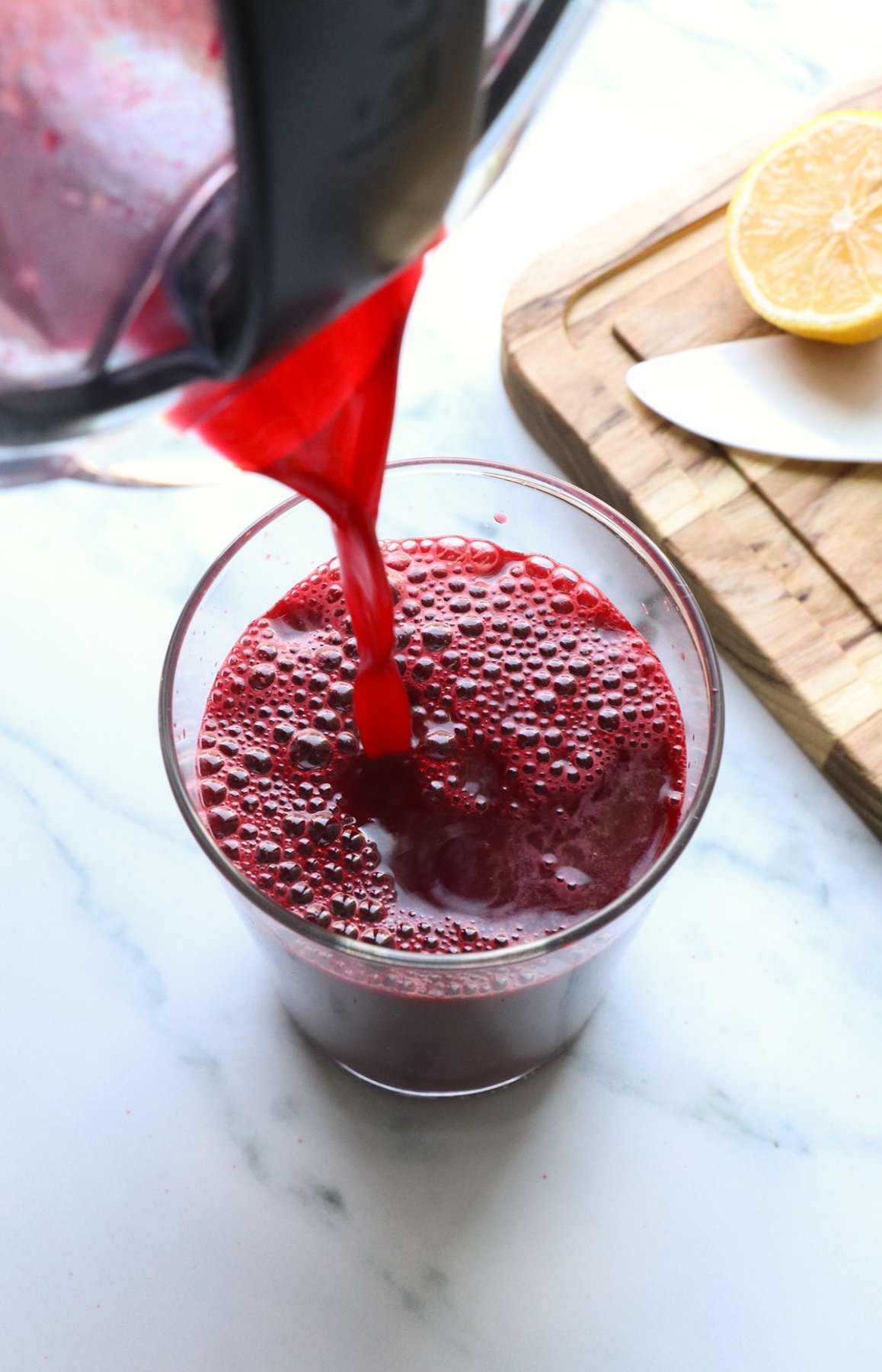 beet juice poured into a glass for serving. 