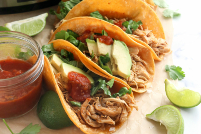 chicken tacos in front of slow cooker