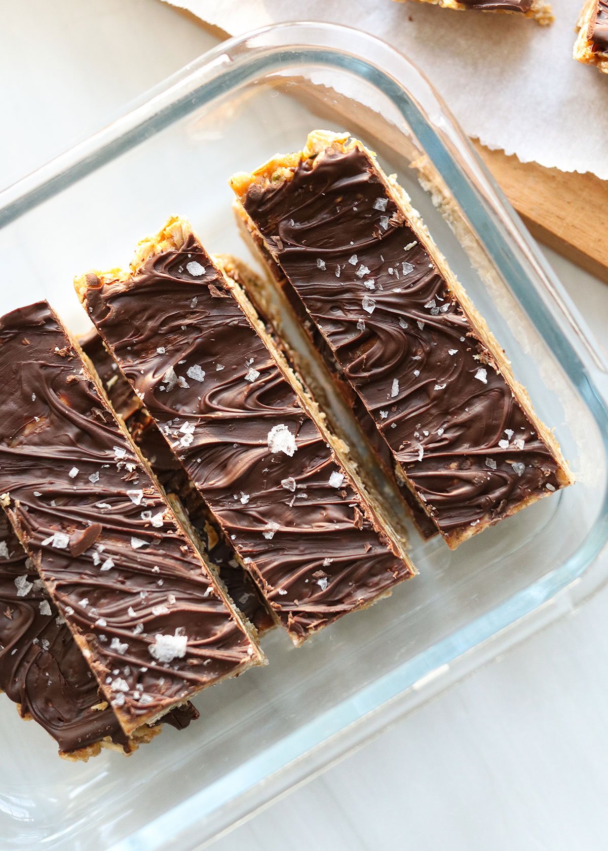 granola bars in glass storage container.