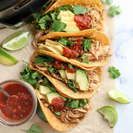 slow cooker chicken tacos stacked together