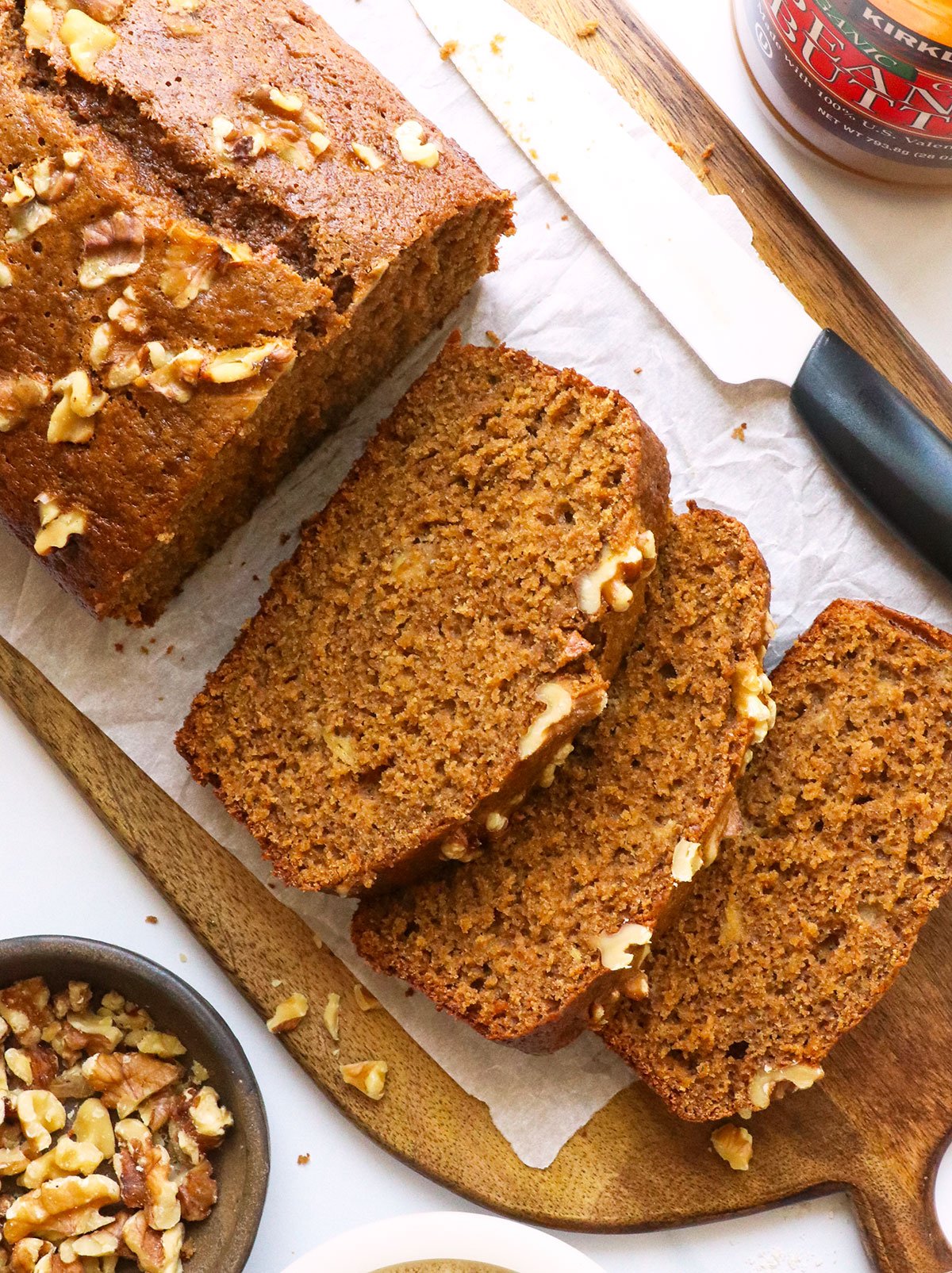 oat flour banana bread sliced on parchment paper.