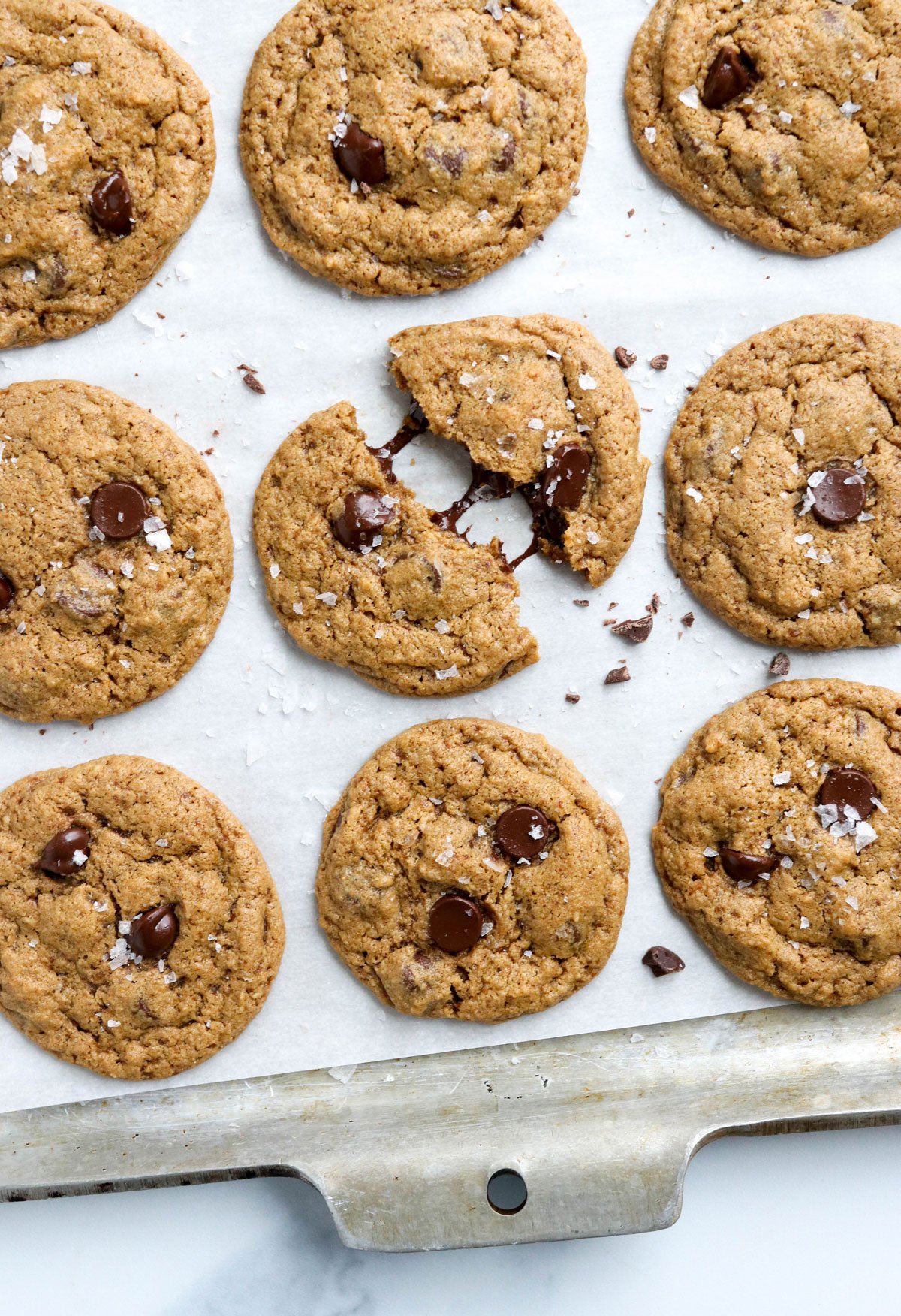 Using a cookie scoop or tablespoon, drop mounds of dough 1 inch apart onto  parchment paper lined baking sheet. Flatten each cookie slightly. Bake for  8 to 10 minutes or until the