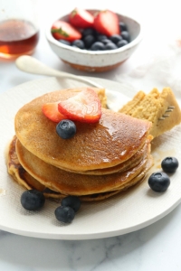 oat flour pancakes with fruit on top