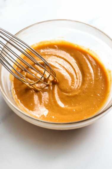 peanut sauce stirred together in glass bowl