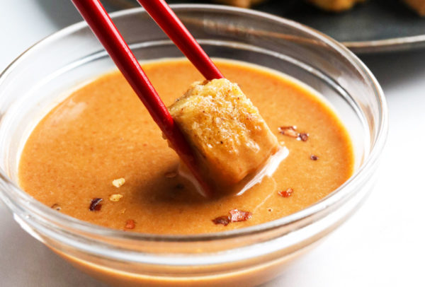 tofu dipped in the finished peanut sauce