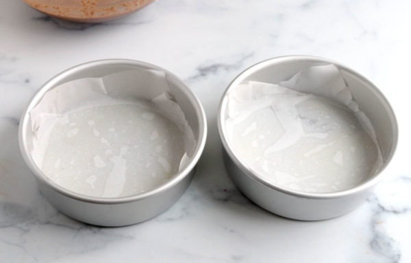 prepared cake pans with parchment paper