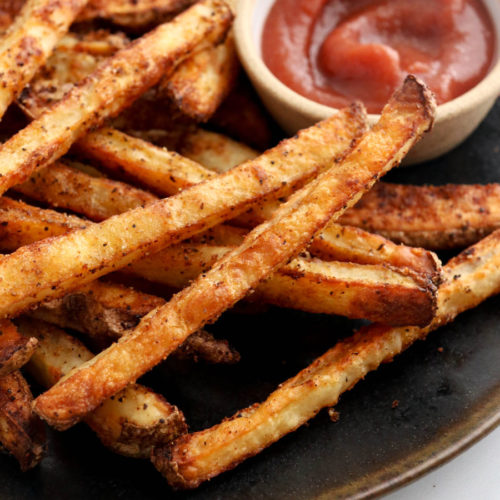 baked french fries on black plate