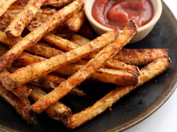 baked french fries on black plate