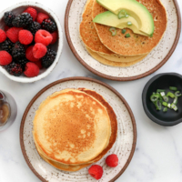 chickpea pancakes topped with avocado and berries