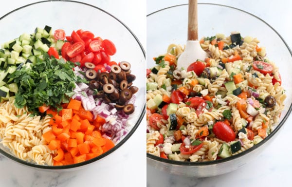 mixing the greek pasta salad together in a large bowl