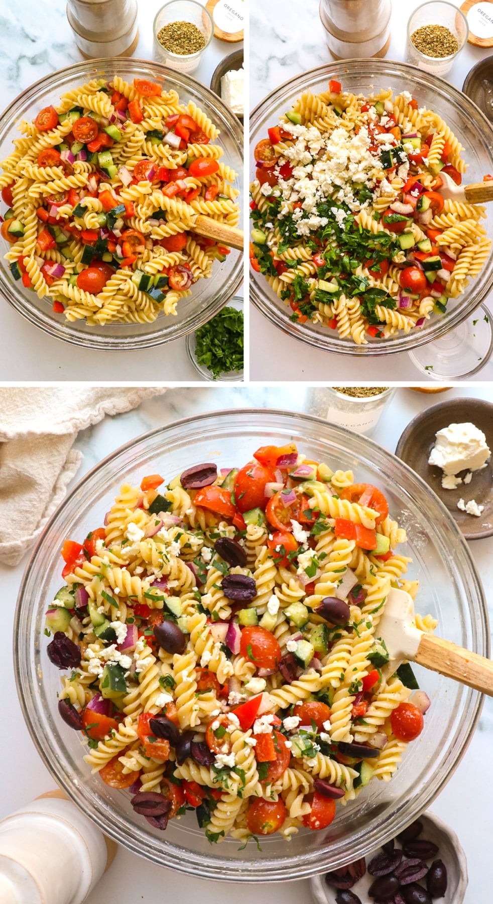 pasta, feta, and parsley added to pasta salad in a glass bowl.