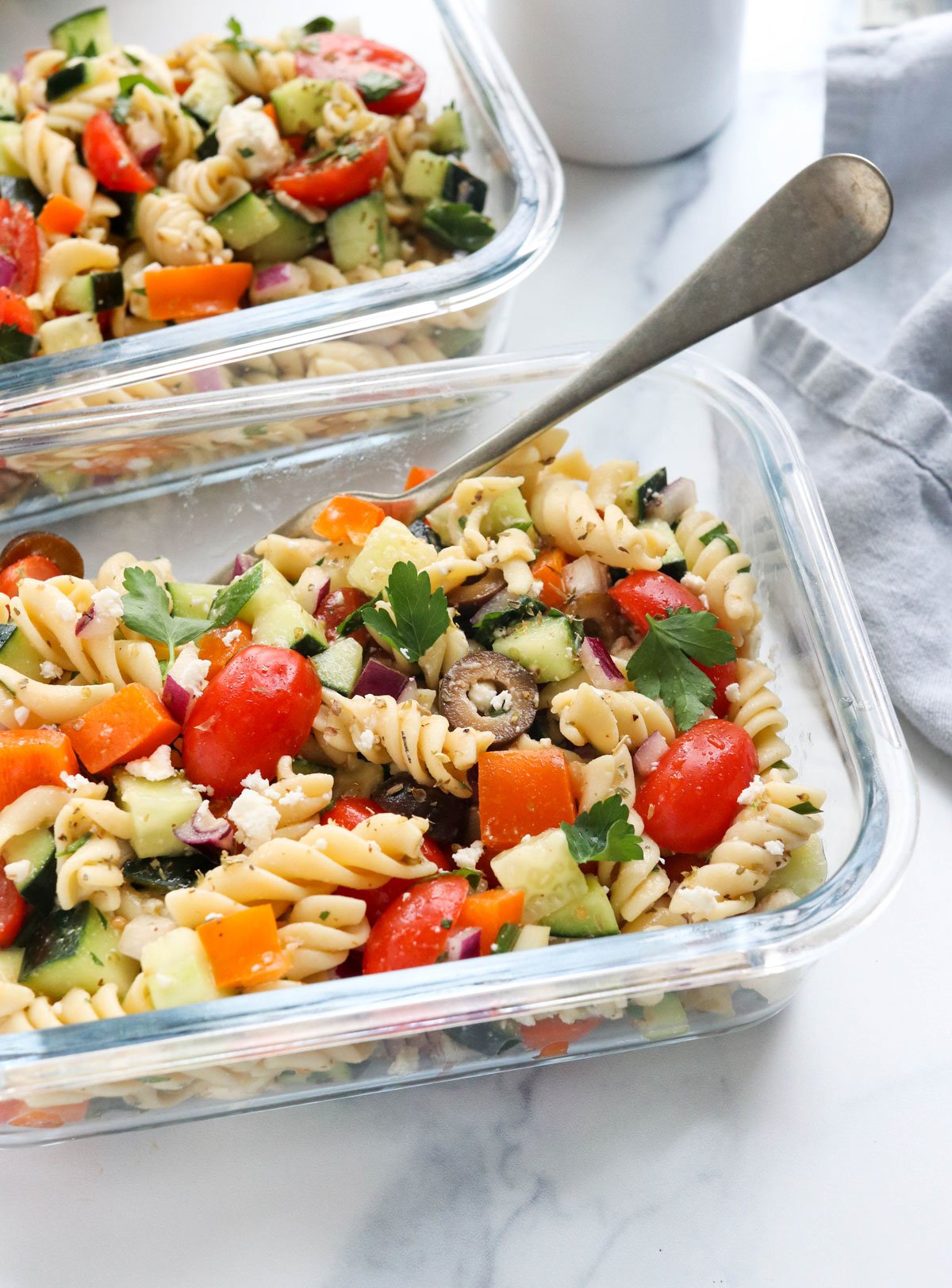 greek pasta salad in glass meal prep container