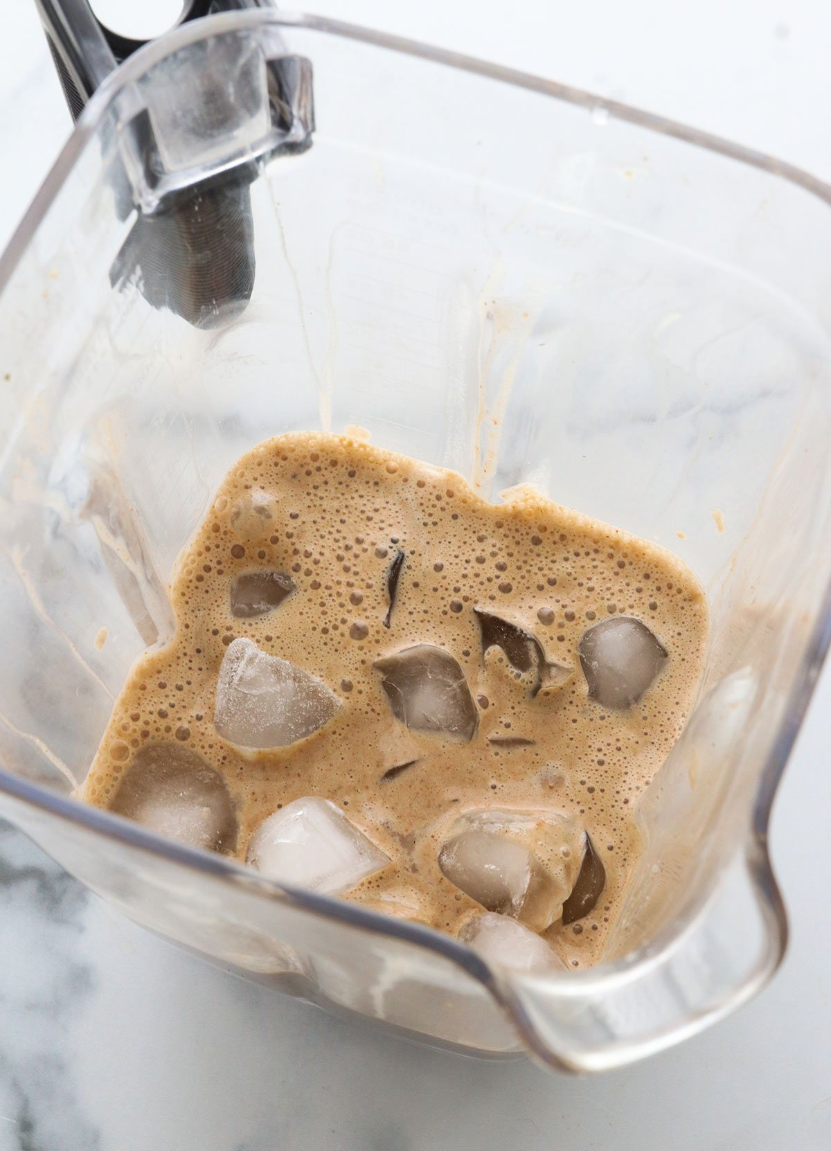 Ice added to coffee smoothie mixture.