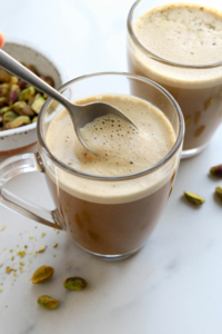 pistachio latte with spoon of foam