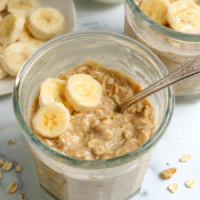 banana overnight oats in a jar with a spoon