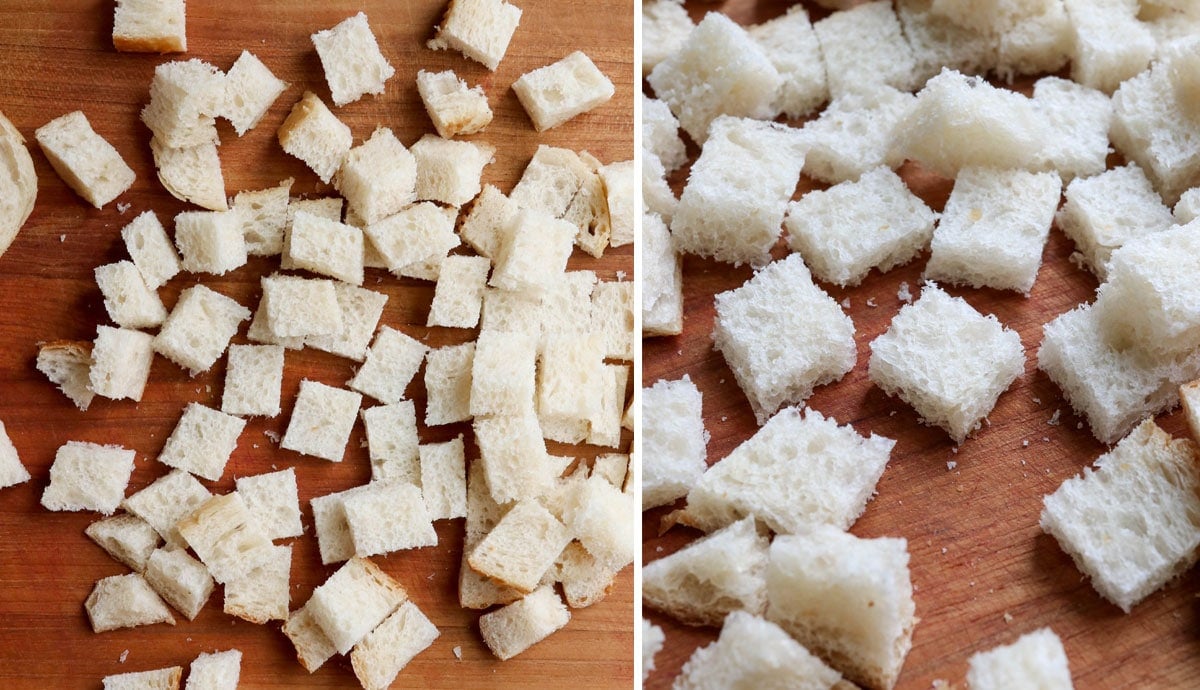 bread cut into cubes on cutting board