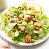 vegan caesar salad topped with croutons and chickpeas.