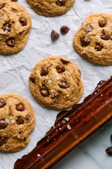 almond flour cookies topped with salt on a pan.