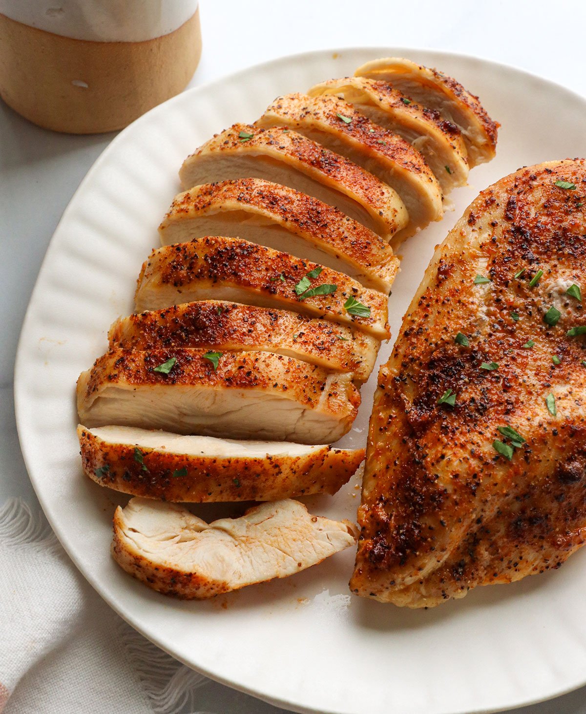 Fried chicken slices on a plate.
