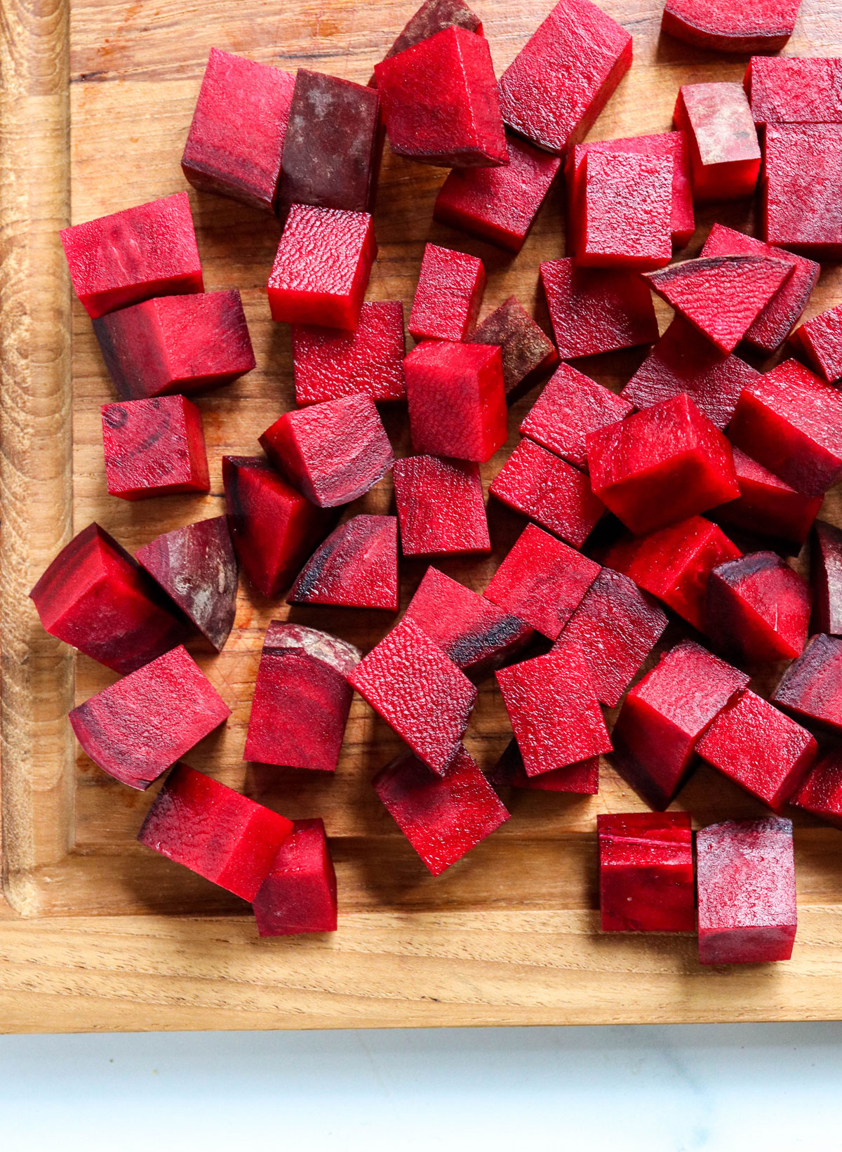 beets sliced into cubes on cutting board