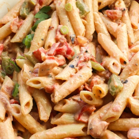 cajun pasta in a creamy sauce in a pan.