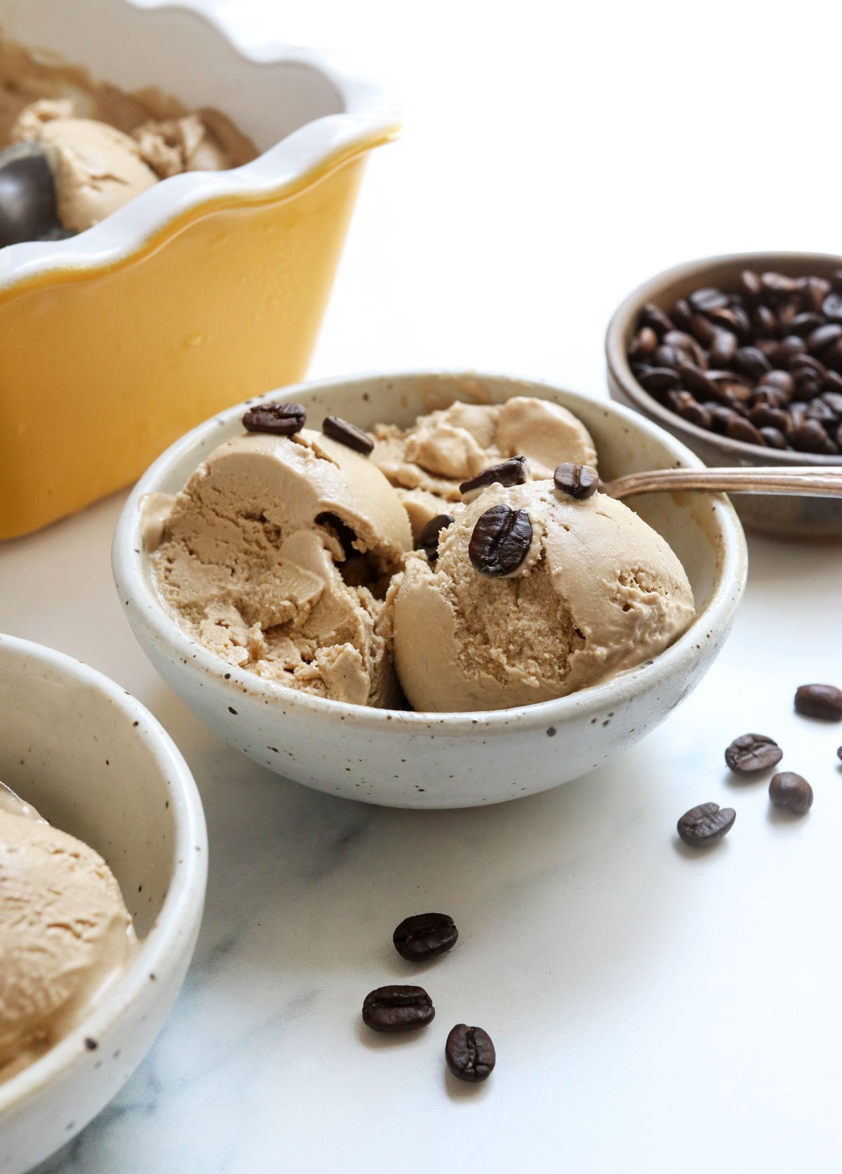 coffee ice cream in bowl with coffee beans