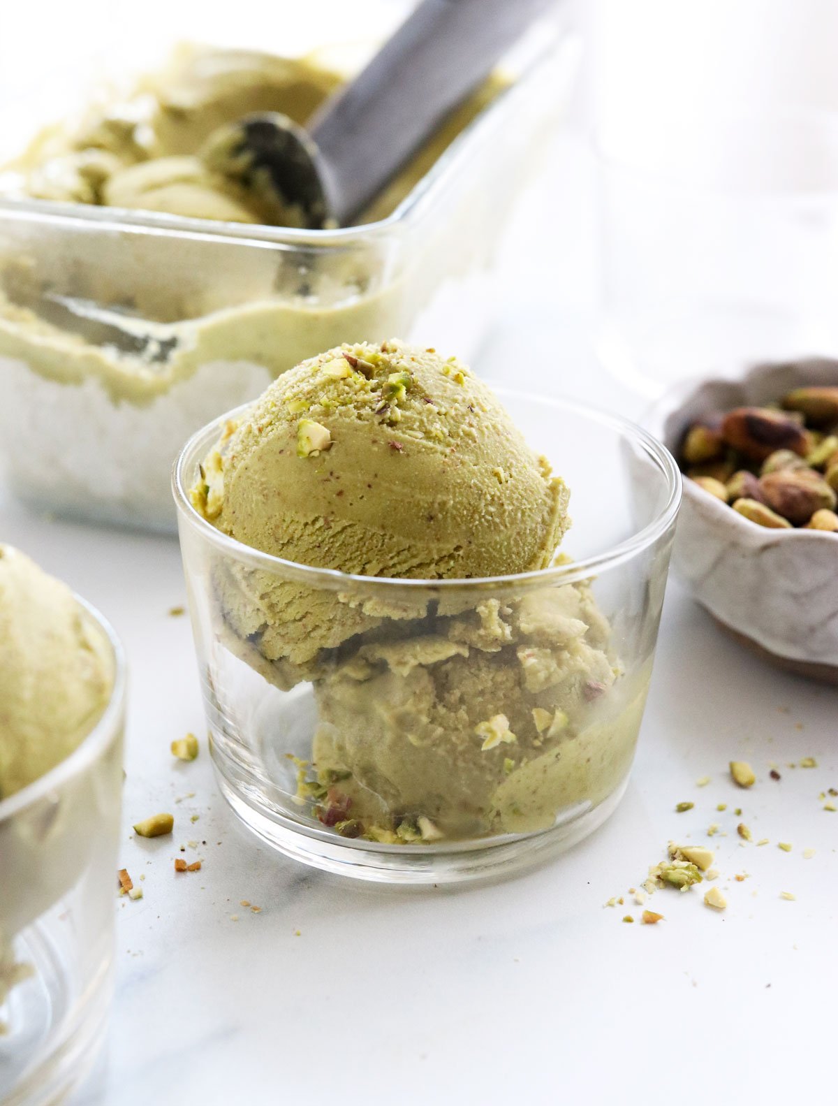 pistachio ice cream in glass serving dish