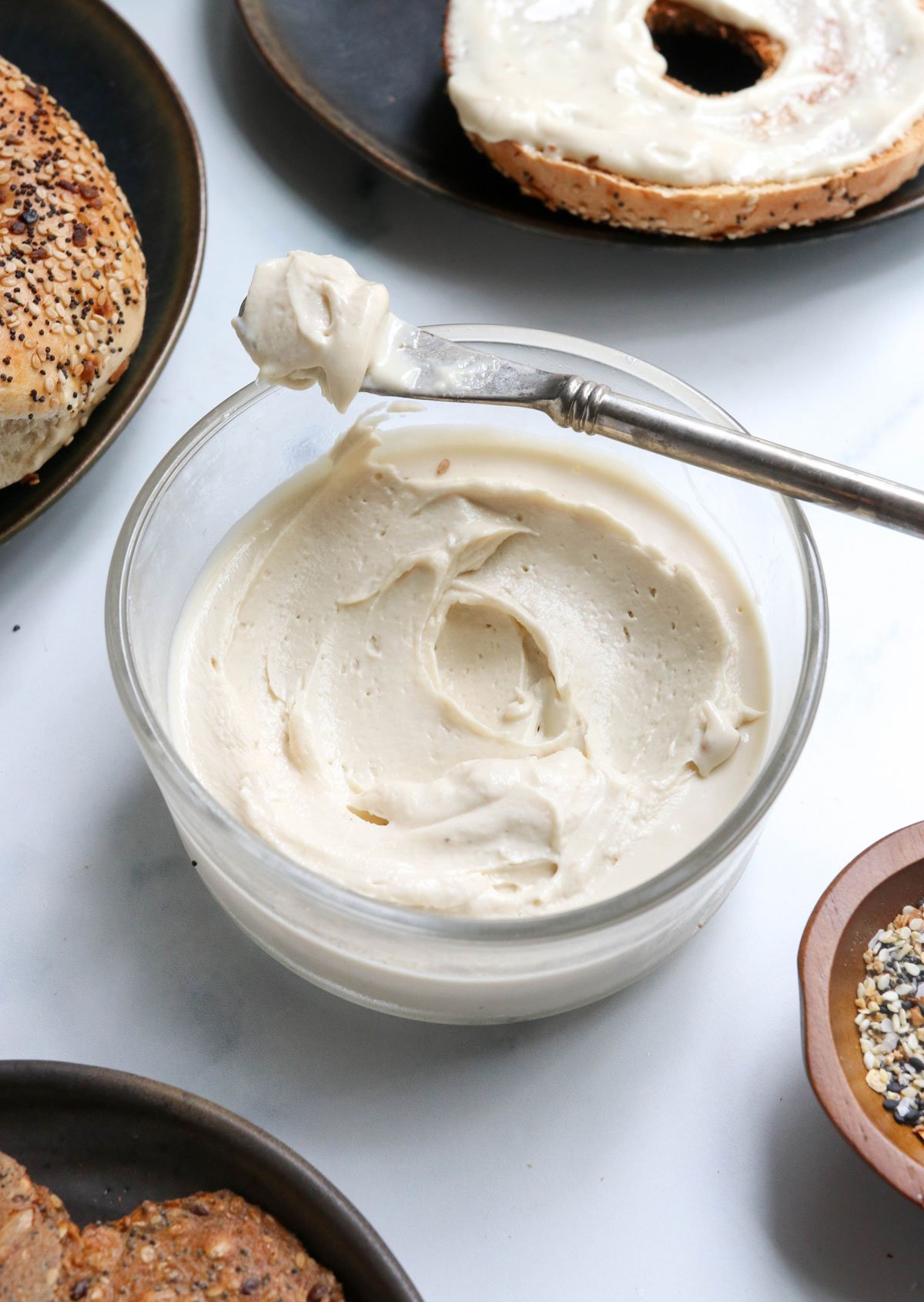 vegan cream cheese with knife on the container