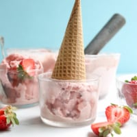 strawberry ice cream cone upside down in bowl