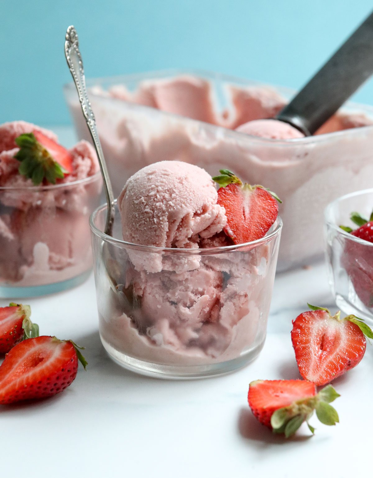 strawberry ice cream in glass bowls