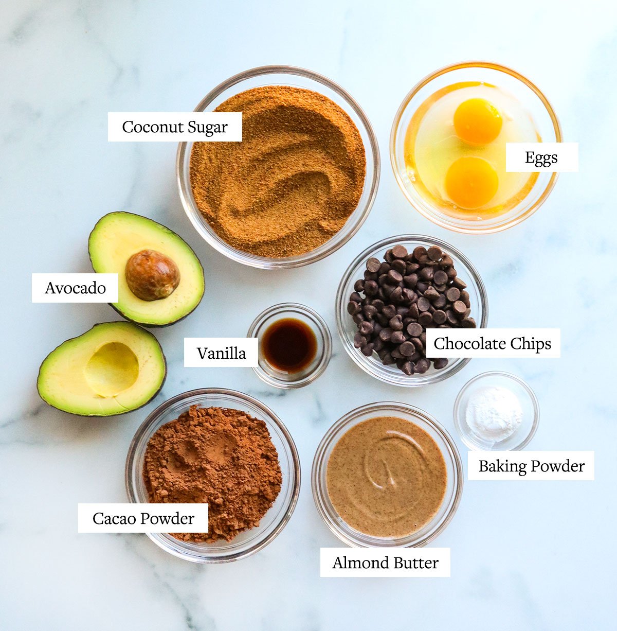 avocado brownie ingredients labeled in glass bowls.