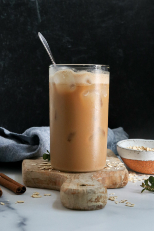 iced oat milk latte with black background