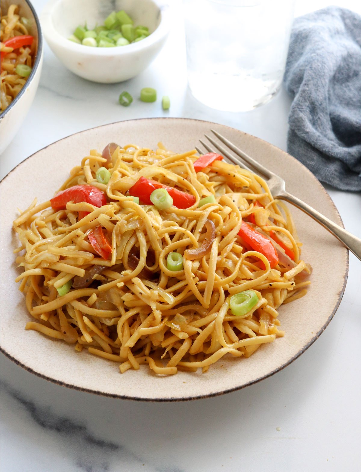 singapore noodles on plate with fork