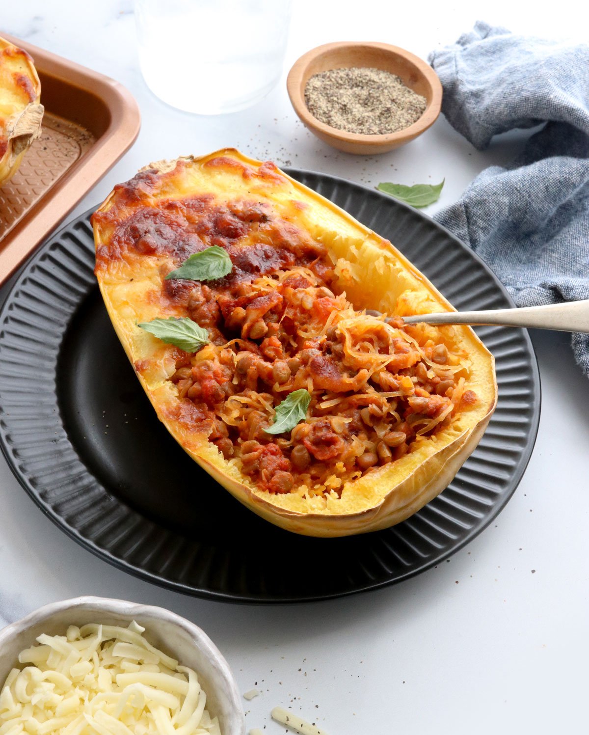 stuffed spaghetti squash at an angle on plate